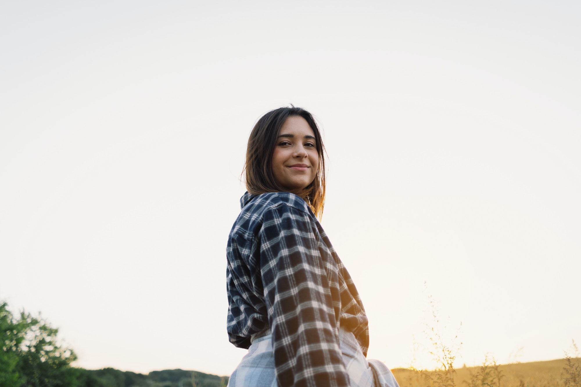 Portrait of a teenage girl on the field.