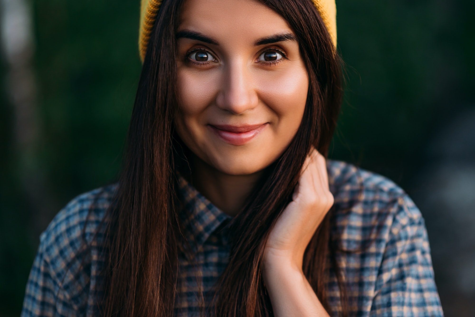 Portrait of a traveler girl in a yellow cap. Portrait of a female tourist